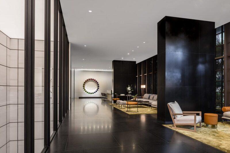 The discreet lobby is furnished with pieces designed by Antonio Citterio along with the entry’s centerpiece, Polychromatic Chronology 2016, by famed artist Olafur Eliasson
