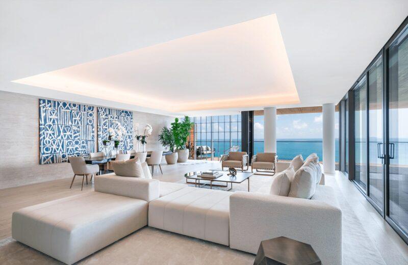 Great rooms in the Arte feature wide-plank European white oak floors in a brushed pearl finish, travertine accent walls, and corner balconies with endless Miami Beach & Atlantic Ocean views