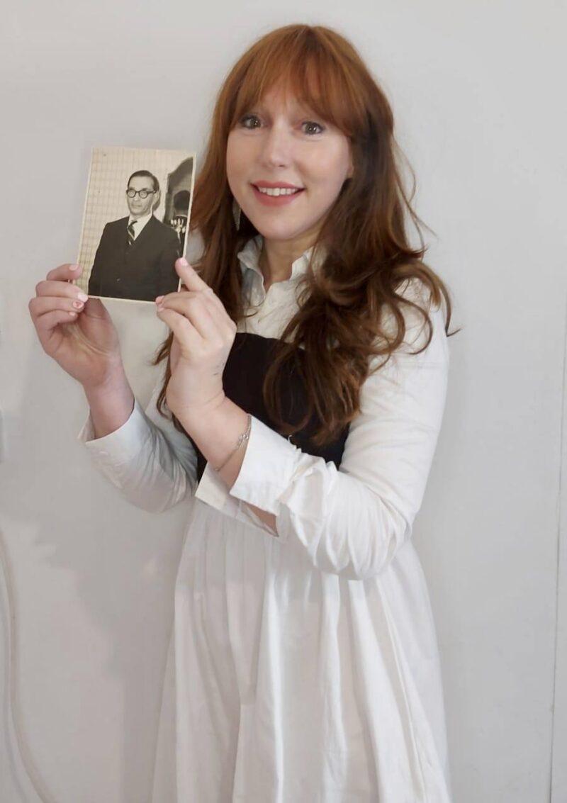 Rivka Donin holds a photo of her heroic grandfather Karl Abrahams