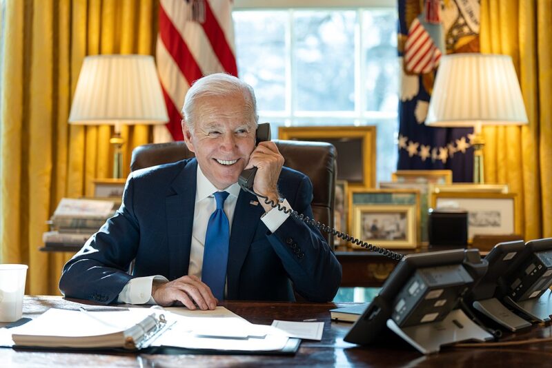 President Joe Biden talks on the phone in the Oval Office on February 14, 2023. (Official White House Photo by Adam Schultz)