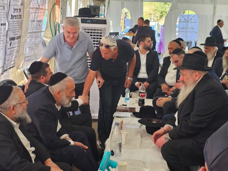Colel Chabad Director Rabbi Sholom Duchman at the shiva home of the Deri family