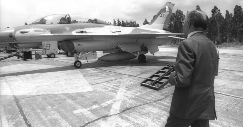 Prime Minister Menachem Begin looking at an Israeli jet