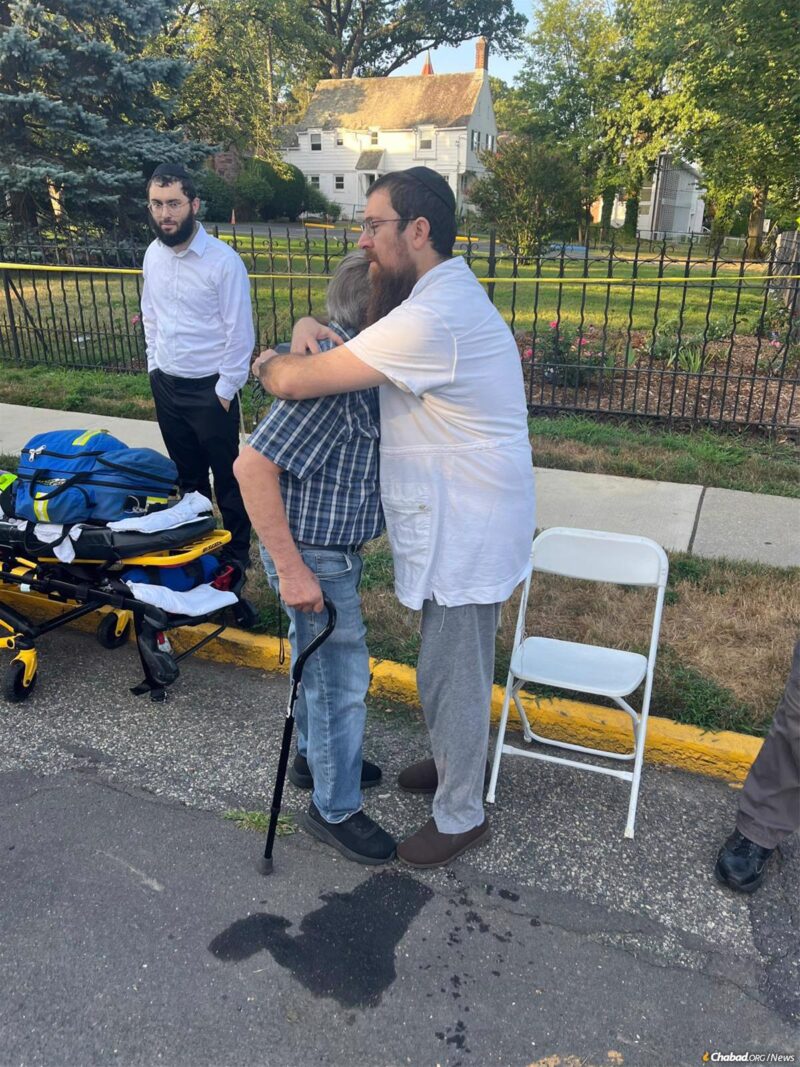 Rabbi Lerman comforts a member of his community