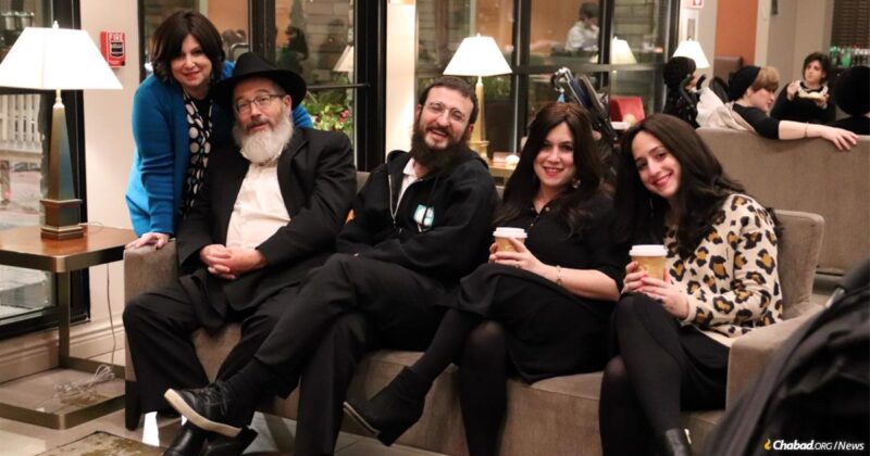 Tsevie Gopin is at far left, her son in law Dovid Margolin is in the middle. The photo was taken during a celebration of her 60th birthday
