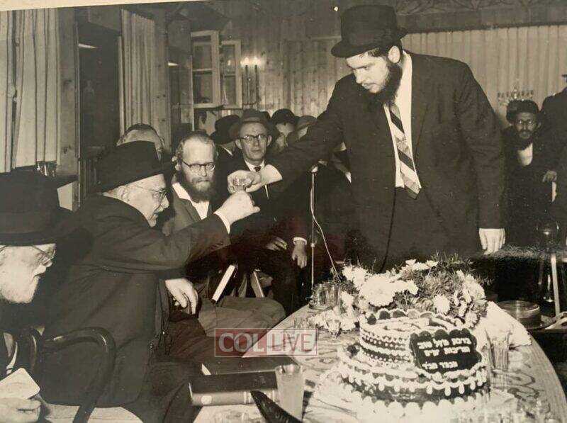 Rabbi Adin Even-Israel Steinsaltz looks on as R' Koppel Bacher shares Mashke from the Rebbe, with President Zalman Shazar in the President's residence in honour of his birthday. 1965/5725.<br />
