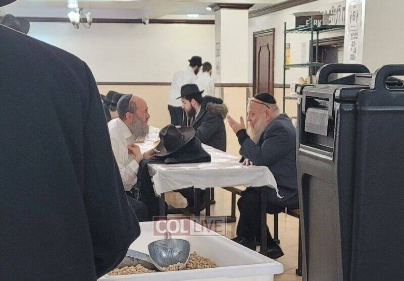 Executive Director Rabbi Moshe Meir Gluckowsky (left) speaks with the new administrator Rabbi Benjy Stock