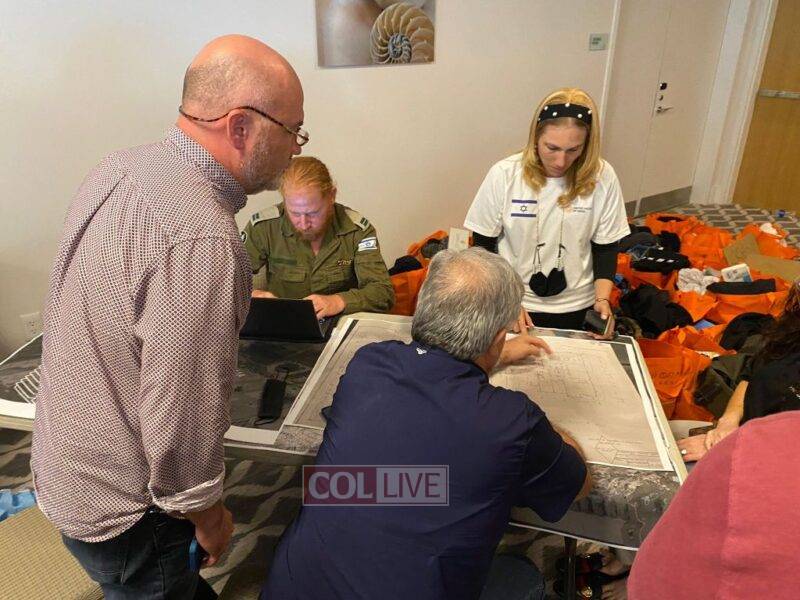 United Hatzalah team member Batya Jaffe assisting family members recreate the apartment of their missing loved one