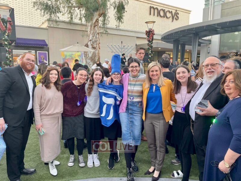 Shaina Welner (center) at a Chanukah event with Arizona Head Shluchim Rabbi Zalman and Tzipi Levertov and Phoenix Mayor Kate Gallego
