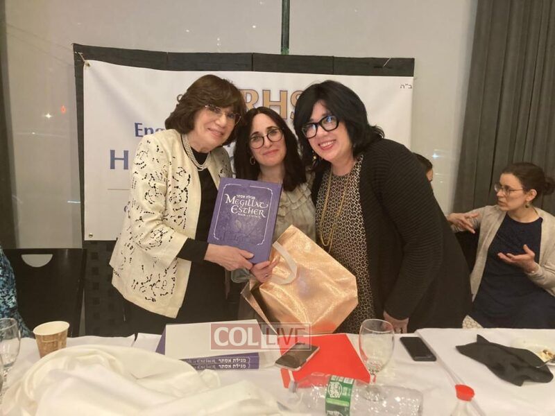 Mrs Laine at the Left and Mrs Sharfstein center presented a book (Megilas Esther, published by Kehot) to each of the teachers