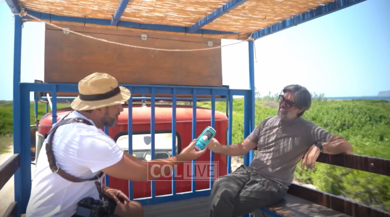 It's not a Sukkah; it's a clunker pickup on an impossibly narrow, bumpy path.<br />
Filmmaker Robert Serini with Gianni Borrometi, trundling towards the marina