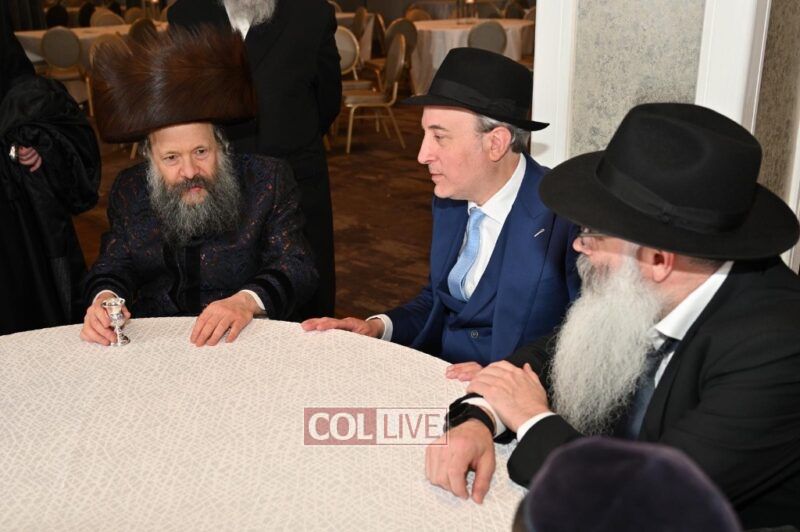 Phillip Gross (right) with Beijing Shliach Rabbi Shimon Freundlich and the Bobover Rebbe