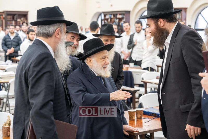 Rabbi Raitport is greeted by Rosh Yeshiva of Oholei Torah, Rabbi Shlomo Kaplan