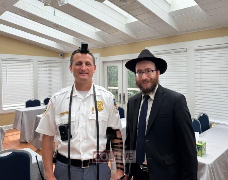Rabbi Chesky Tenenbaum with a Jewish Baltimore Police Officer